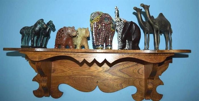 #2212: Fun Collection of Elephants & Camels & Wall Shelf
A collection from around the world, camels and elephants.Create a charming display with this fun collection.

Wall shelf, 24"W x 7"D x 8"H