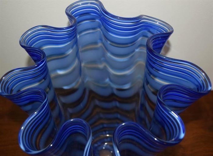
#2219: Mouth blown art glass cobalt vase
Mouth blown art glass, master artist ribbon shape, cobalt color vase.

10.5"H