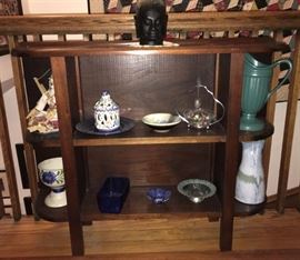#2440: Stand with things
Demi lune display shelf , great shape to use throughout your home to display your collectibles and great items.

35” x 9” x 29”H