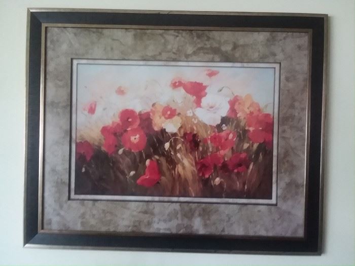 Bright floral picture with glass cover and framed.