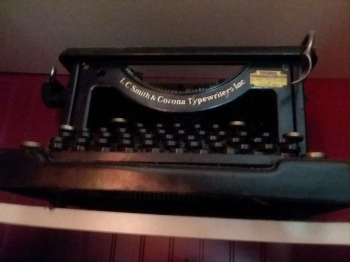 Antique Smith and Corona typewriter - metal and still has the ribbon.