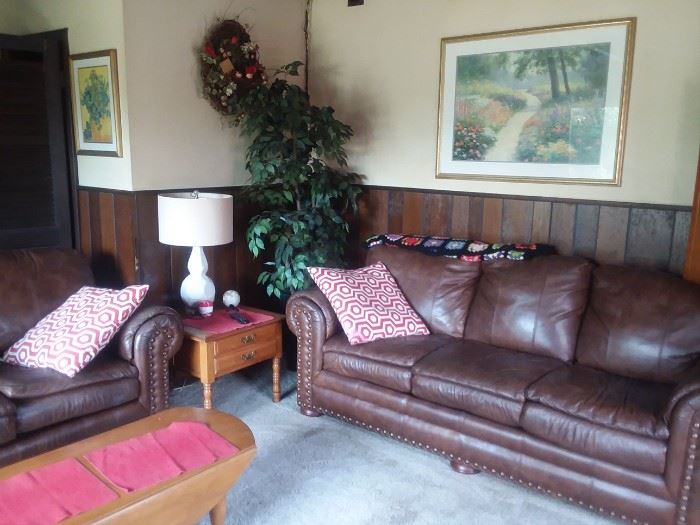 Leather sofa and loveseat with brass studs.  Great condition.