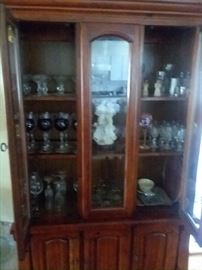 John M. Smythe credenza - pine - 40 years old - one owner.  Part of a set of table/chairs and sideboard.  will sell as set or separately.  Credenza full of antique glassware and art sculpture.  Storage underneath 