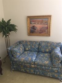 2-cushion love seat and iron plant stand, framed art