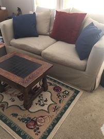 Love seat / sleeper sofa, side table and area rug