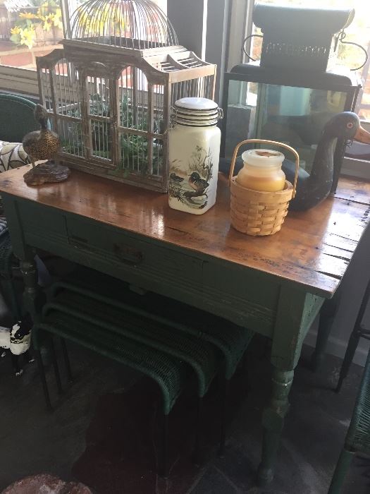 Primitive table with wicker nesting tables, birdcage, decoys, lanterns... just a sampling of the many treasures