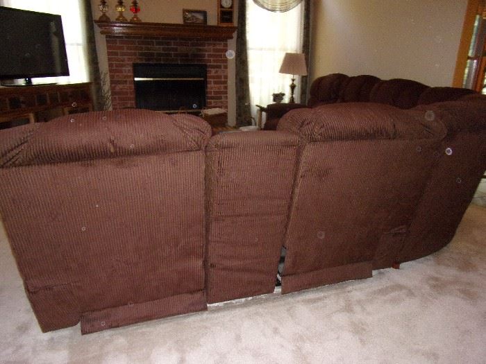 Sectional couch with reclining seats (4) on each end. 