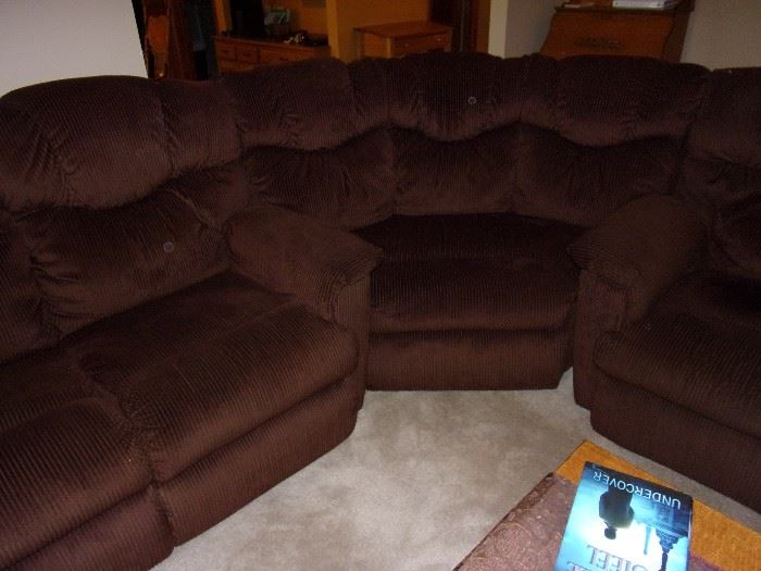 Sectional couch with reclining seats (4) on each end. Pictured is center piece, no arms.