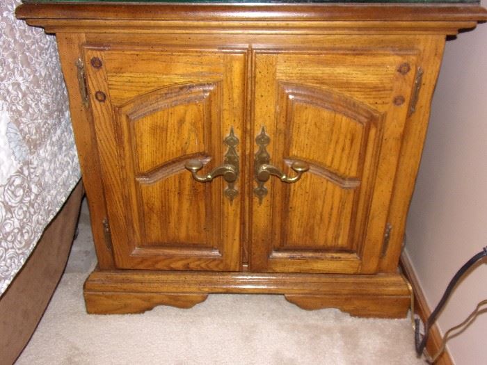 American Drew, Inc. nightstand with protective glass top.