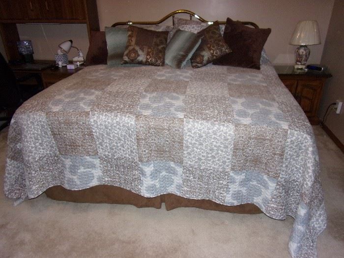King size mattress, box spring, foam topper and metal headboard, as well as linens.