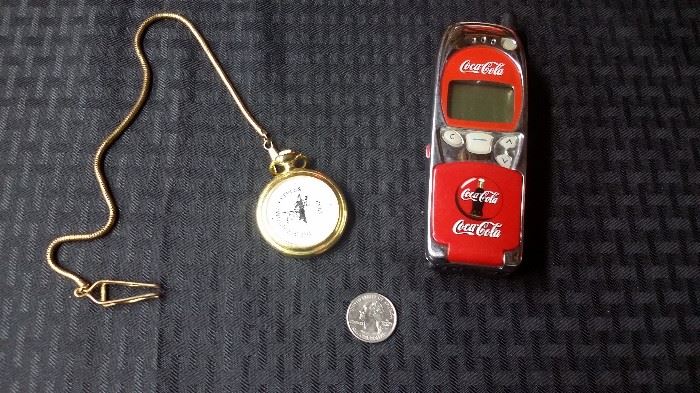 Coke pocket watch and Nokia phone.