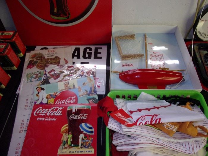 Coca Cola sign, calendars, bags, etc.