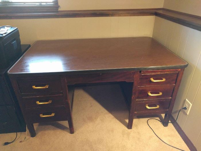 Man-sized desk! 1940's vintage. Huge! One file drawer, 4 box drawers, pull-out work surface on each side. Original finish.