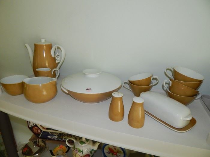 Noritake - Simple, Gorgeous China. The color is Tan but is referred to as Brown.
