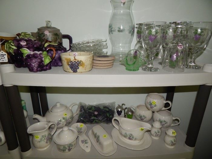 Grapes Anyone? Top Shelf has Grape Coffee Set, Grape Wine Glasses and More . . Second Shelf is Pfalzgraff Grapevine Gravy Boat, Butter, Salt & Pepper, Cream & Sugar, Spoon Rest. There is a bag containing many grape cluster drawer pulls.