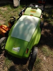 "Neutron" Battery Operated Mower with Bagger. Has an Extra Battery , A Weed Whip Attachment