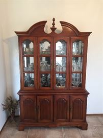  Super nice china hutch loaded with glass shelves and front and mirrored back. Lots of storage underneath 