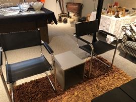 set of two chrome and leather chairs, leather rag rug and mid-century cube tables