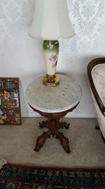 Several marble top tables