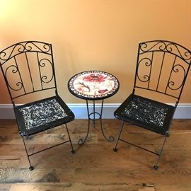 Hand painted bistro table with folding chairs.