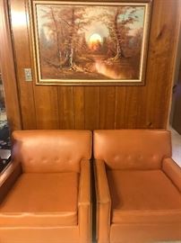 Pair of orange mid century modern chairs with extra deep seats 