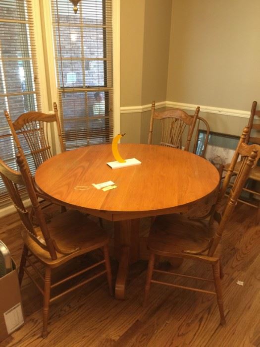#52 wood table/4chairs 47"round x 37"  $175