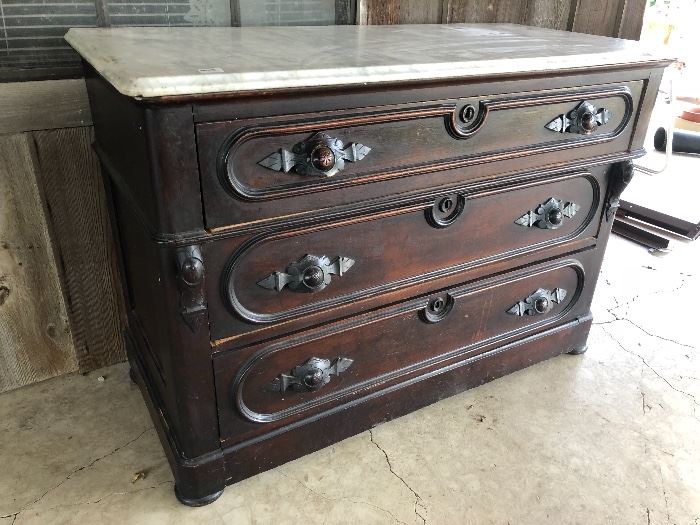 Antique Victorian dresser with marble top and original pulls, circa 1870.