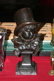 15 inch bronze of a young buy with a top hat marked Houdon.F:1823