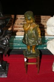 13 inch 19th century bronze of a little standing on a stool with original patina