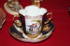 blue and white hand painted Dresden 2 handled cup and sip plate