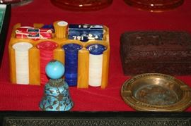 Catalin poker chip caddy, Egyptian lacquer advertising ash tray, cinnabar box, Chinese silver enamel bell, etc.