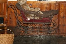 wicker baby buggy with iron wheels