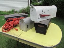 vintage mail boxes , extension cords, hatchets, hammers, tools, vintage yellow enamel top table