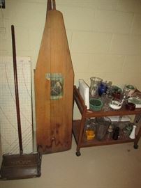 Antique ironing board and carpet sweeper