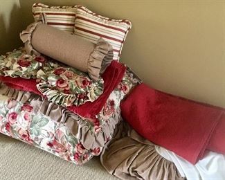 Skirt, comforter; 2 burgundy, 2 Floral, mocha shams; 2 Floral,2 striped throw pillows; 1 neck roll pillow
