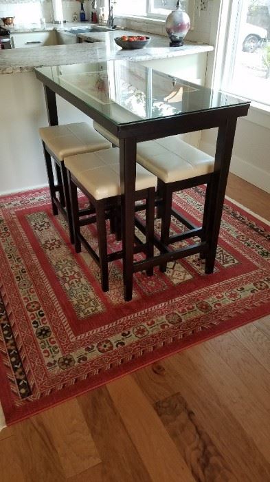 Contemporary Black Lacquer Stools and High Dining Table. One of the wonderful carpets. This one is actually square. 