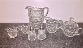 Fostoria water pitcher, salt and pepper shakers, small and large cream and sugar sets