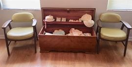 Lane cedar chest, 2 Mid-Century office chairs and various vintage baby clothes