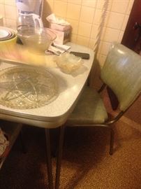50's formica/chrome table with 4 chairs .