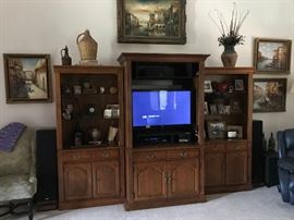 Large wooden entertainment center - rca surround sound - oil paintings