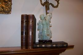 Jade figure, books