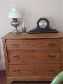 Eastwood Chest Hand Carved Oak. Mantle Clock and Punched Silver plate Oil Lamp with Matching Candle Holders & Globes.