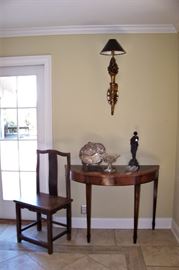 One of a pair of demi-lune tables