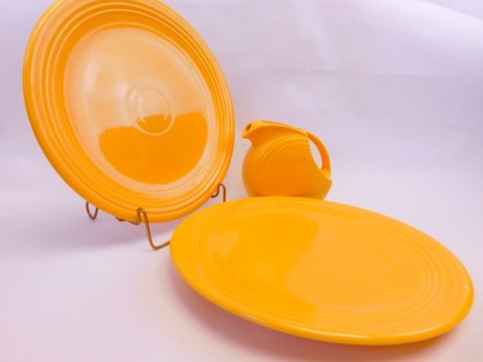 Yellow Vintage Fiesta, pitcher and chop plates.