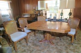 Dining table with four rolling chairs