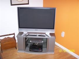 42" Panasonic TV , Stand, wood Magazine rack in Basement