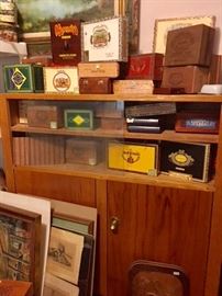large collection of wood and paper cigar boxes