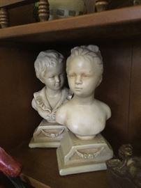 Pair of children bust figurines