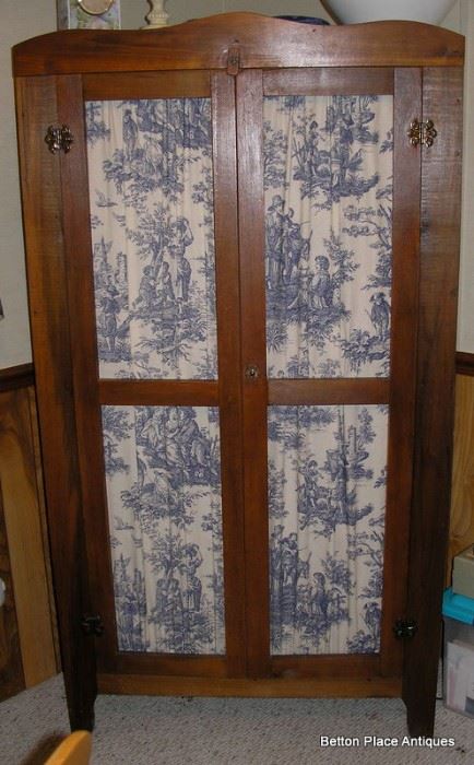 Antique Jelly Cupboard with blue toile fabric front insets.