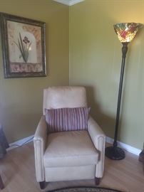 Yellow leather recliner, floor lamp, framed art.